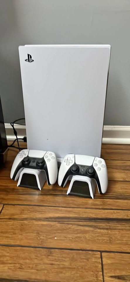 Digital PlayStation five with charging station and two controllers